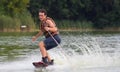 Man wakeboarder on pond in park Royalty Free Stock Photo