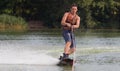 Man wakeboarder on pond in park Royalty Free Stock Photo