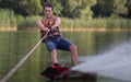 Man wakeboarder on pond in park Royalty Free Stock Photo