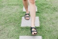 Man walk on concrete block pathway in green grass early autumn falling.Garden landscaping of walk way or pathway.high angle view o Royalty Free Stock Photo