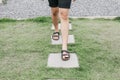 Man walk on concrete block pathway in green grass early autumn falling.Garden landscaping of walk way or pathway.high angle view o Royalty Free Stock Photo