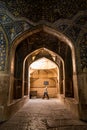 Man walk inside Shah mosque, Isfahan, Iran Royalty Free Stock Photo