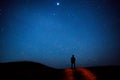 Man walk at night sky stars background