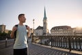 Man walking against cityscape of old town Royalty Free Stock Photo