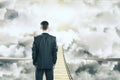 Man is walking on air bridge among the clouds concept Royalty Free Stock Photo