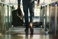 man walking through airport metal detector with carryon bag Royalty Free Stock Photo