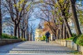 A man is walking through an alley in central Sofia during autumn
