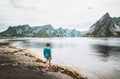 Man walking alone at fjord in Norway Travel lifestyle Royalty Free Stock Photo