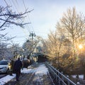 Man walking alone on the road in winter snow