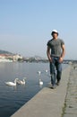 Man Walking Along the Embankment