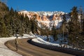 Man walking along roadway in Utah desert in winter