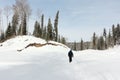 Man walking along a snowy trail, Altai Republic, Russia