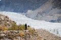 A man walking along the track to see Passu glacier.