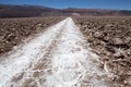 Man is walking along the trail at the salt pan at the Salar of Antofalla at the Puna de Atacama, Argentina Royalty Free Stock Photo