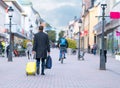 Man walking away with his suitcase and luggage Royalty Free Stock Photo