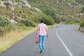 Man walking away holding petrolcan Royalty Free Stock Photo