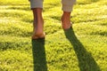 Man walking barefoot on fresh green grass, closeup Royalty Free Stock Photo