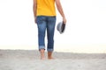 Man walking barefoot on sand at the beach Royalty Free Stock Photo