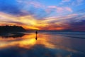 Man walking on the beach at sunset Royalty Free Stock Photo