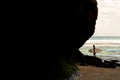 A man walking on the beach with a surfboard. Royalty Free Stock Photo