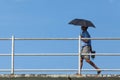 Man walking on the bridge with blue background