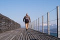 Man walking on the bridge of Rapperswil-Hurden