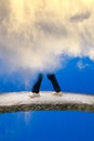 Man walking on the bridge wreathed in the clouds Royalty Free Stock Photo