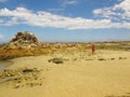 Man walking at Cape Recife nature reserve at Angola bay in Port Elizabeth on Sunshine Coast, South Africa Royalty Free Stock Photo