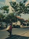 A man is walking while carrying a sack, Tasikmalaya 01 November 2023