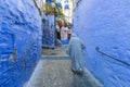 man walking in Chefchaouen street, Morocco Royalty Free Stock Photo