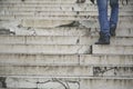 Man walking climb up in old stairs Royalty Free Stock Photo