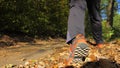 Man walking cross country trail in autumn forest Royalty Free Stock Photo