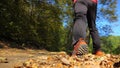 Man walking cross country trail in autumn forest Royalty Free Stock Photo