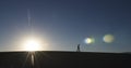 Man Walking in Desert Royalty Free Stock Photo