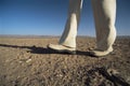 Man walking in desert, low section Royalty Free Stock Photo
