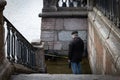 The man is walking the dog. Flooding in the city. Royalty Free Stock Photo