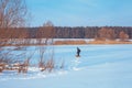 Man walking with dog on the frozen lake Royalty Free Stock Photo