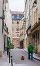 Man walking dog in the Latin Quarter Paris. France