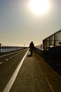 Man walking down the boardwalk Royalty Free Stock Photo