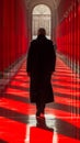 A man walking down a hallway with red walls and columns, AI Royalty Free Stock Photo