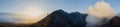 Man walking on the edge of a volcano crater at sunrise in Bromo, Indonesia Royalty Free Stock Photo