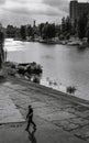 Man walking in front of the Dnieper river channel in Rusanivka public park in Kyiv City, Ukraine