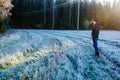 Man walking on frozen field Royalty Free Stock Photo