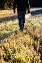 Man walking on frozen field Royalty Free Stock Photo