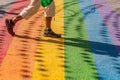 Man walking on gay rainbow crosswalk in Montreal gay village Royalty Free Stock Photo