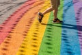 Man walking on gay rainbow crosswalk in Montreal gay village Royalty Free Stock Photo