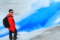 Man walking in a glacier.