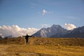 Man walking happily through mountain path