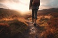Man walking in hiking boots at unset on a hiking trail. Generative AI