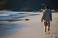 Man walking his dog at the beach in South Africa Royalty Free Stock Photo